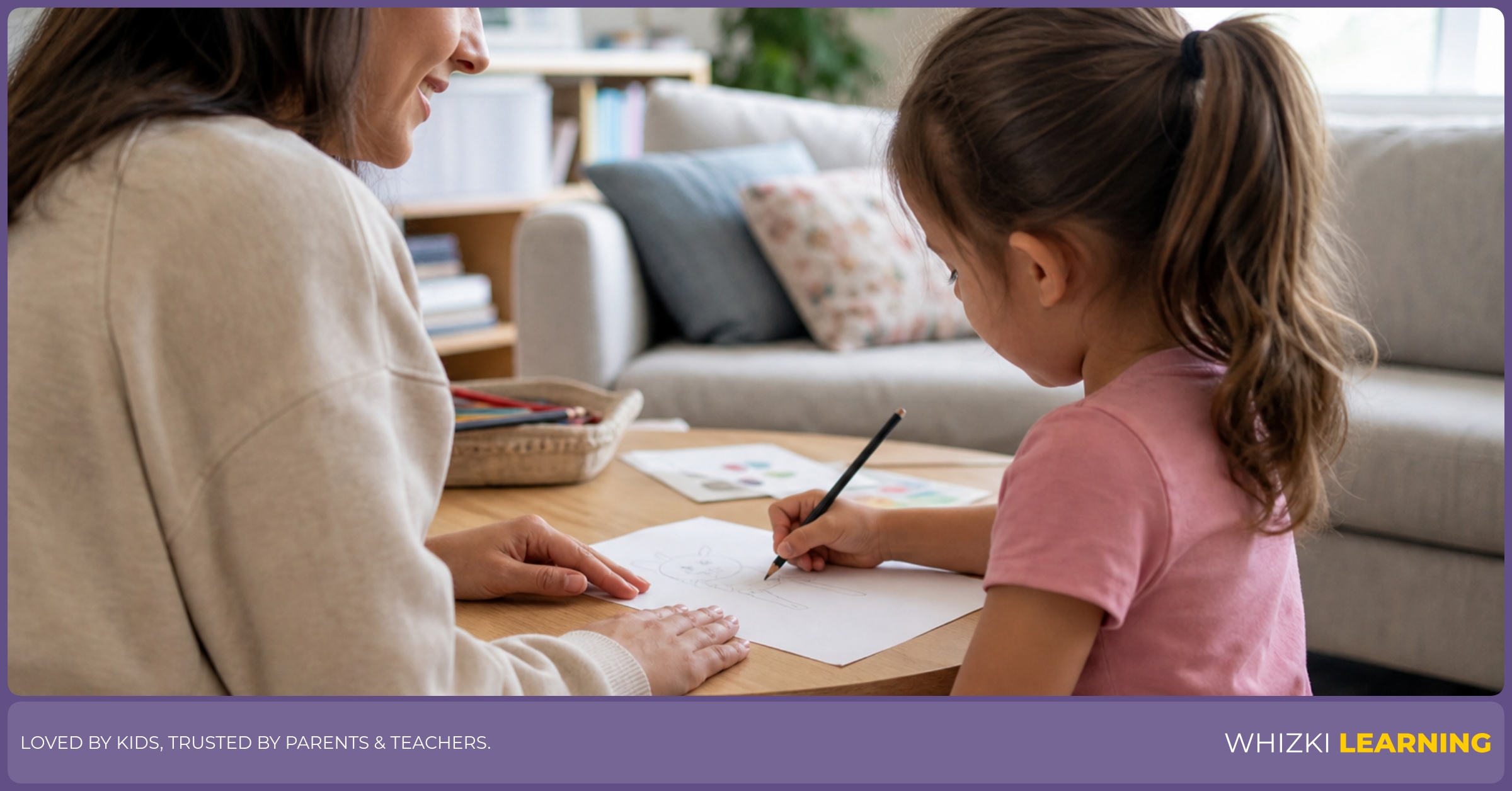 A caregiver sits beside a child and observes pencil grip during a calm drawing activity.