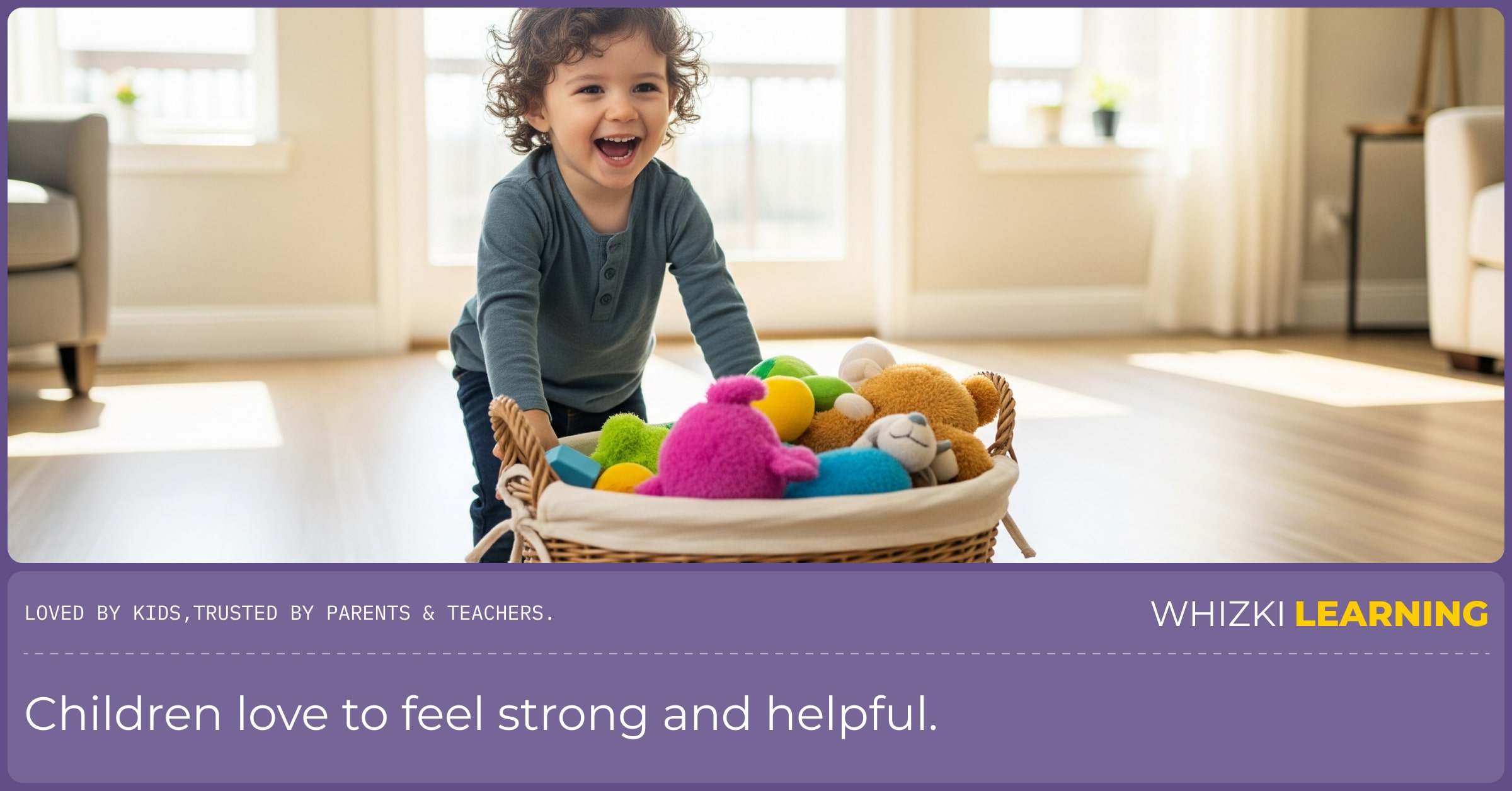 A young boy giggling as he pushes a large laundry basket across the floor of his living room.