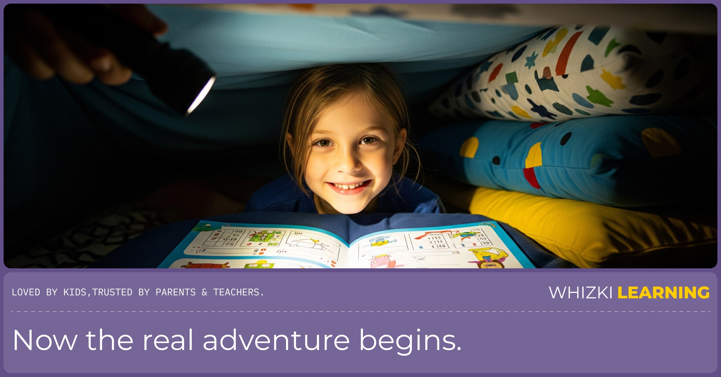 View from inside a dark pillow fort. A smiling child's face is lit by a flashlight as they draw in a workbook on the floor.