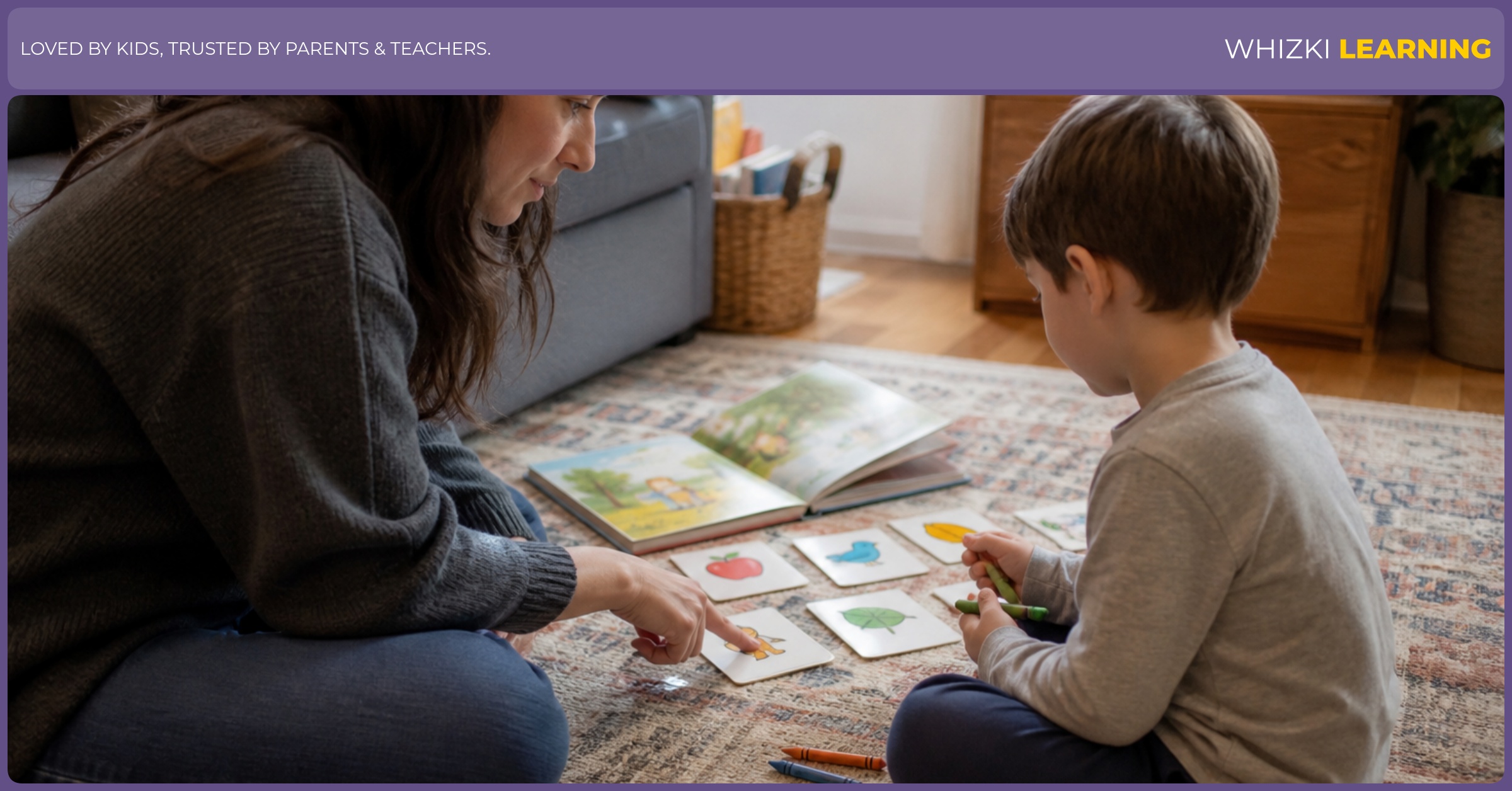 A parent sits beside a young child practicing with paper cards and crayons in a calm living room.