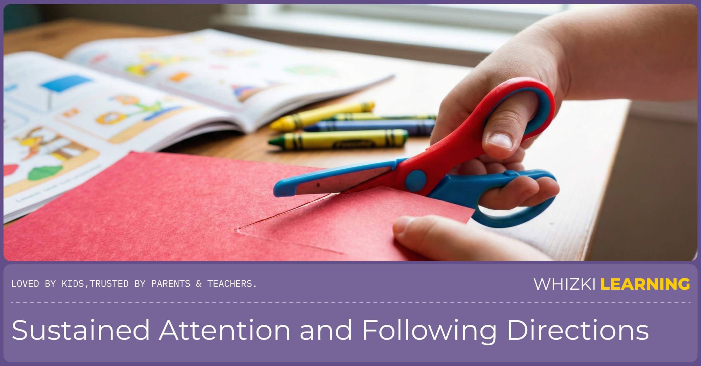 Close-up of a child's hands using safety scissors to cut paper, a key pre-writing fine motor skill.