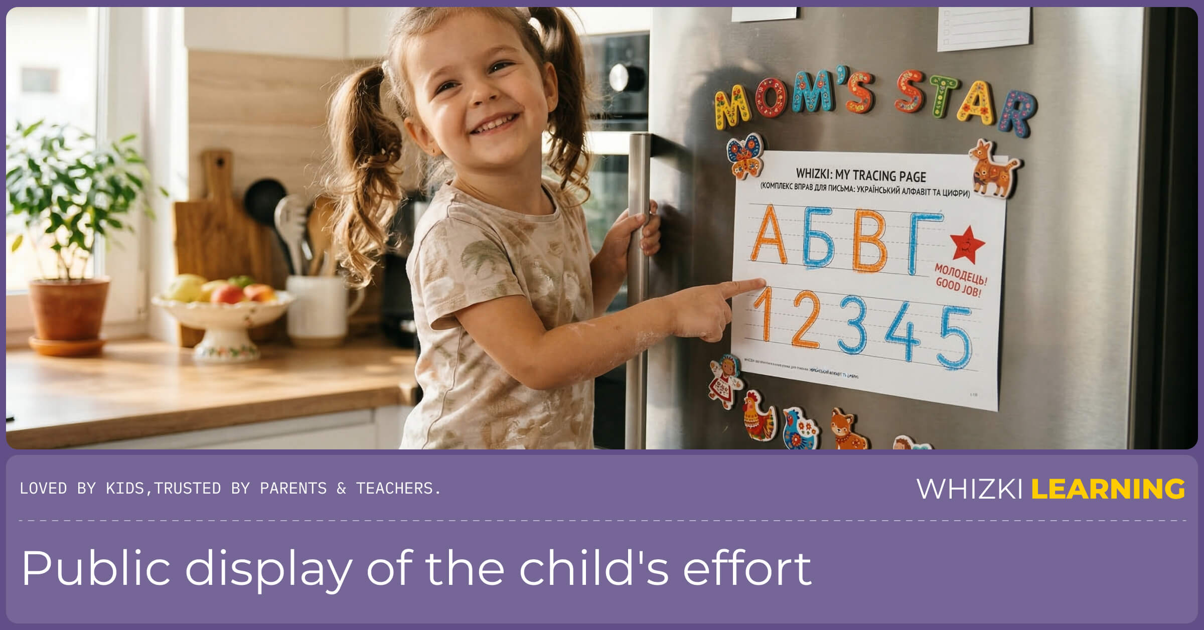 A joyful five-year-old child standing next to a stainless steel refrigerator, pointing at their finished Whizki workbook page held by a magnet.