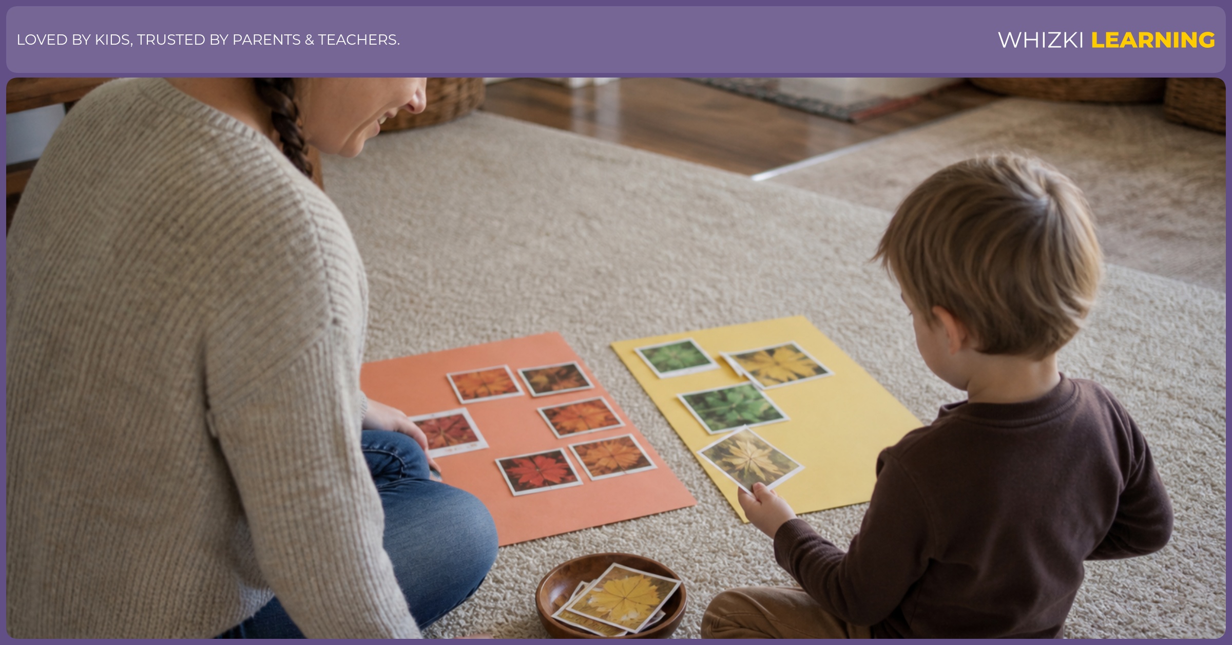 A caregiver and child sort fall photo cards on a paper mat in a living room.