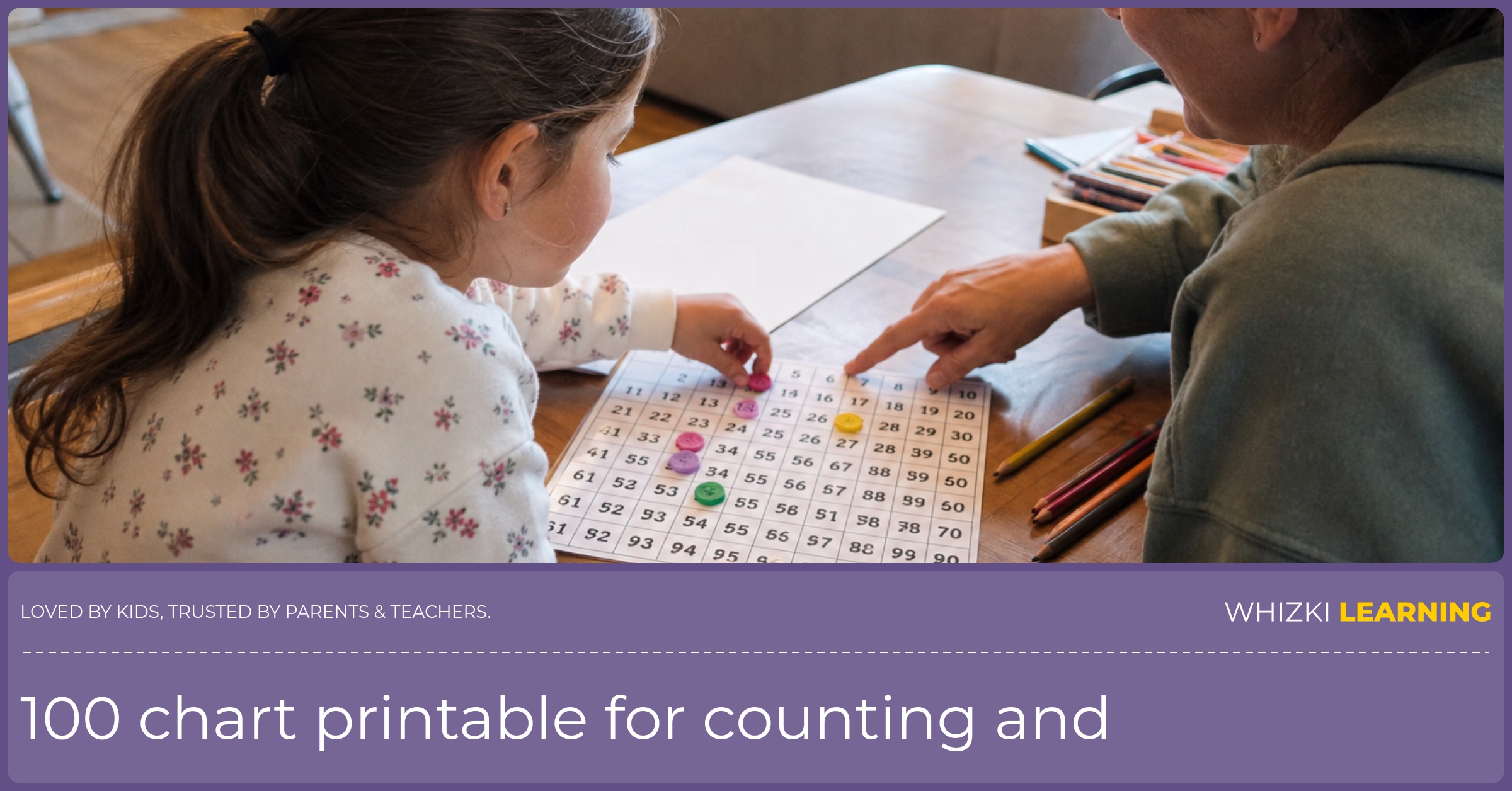 A caregiver points to a 100 chart while a child places small counters on the page at a kitchen table.