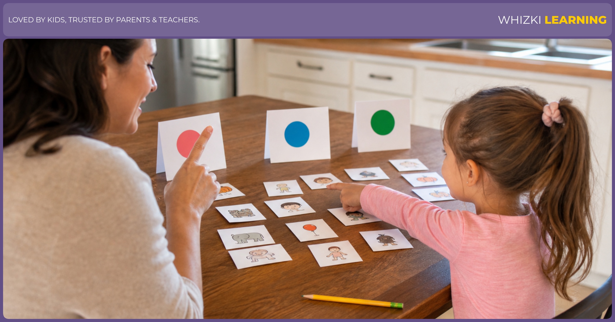 Parent and child at a kitchen table sorting E adjective cards into three piles, using fingers to point and a calm, focused tone