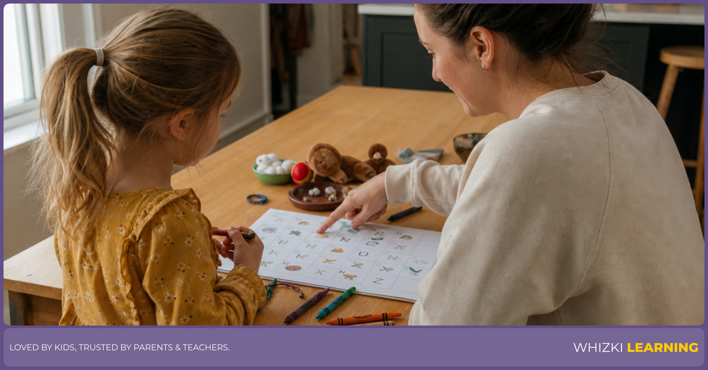 A parent and child sit at a kitchen table using a paper letter planner with crayons and small household objects.