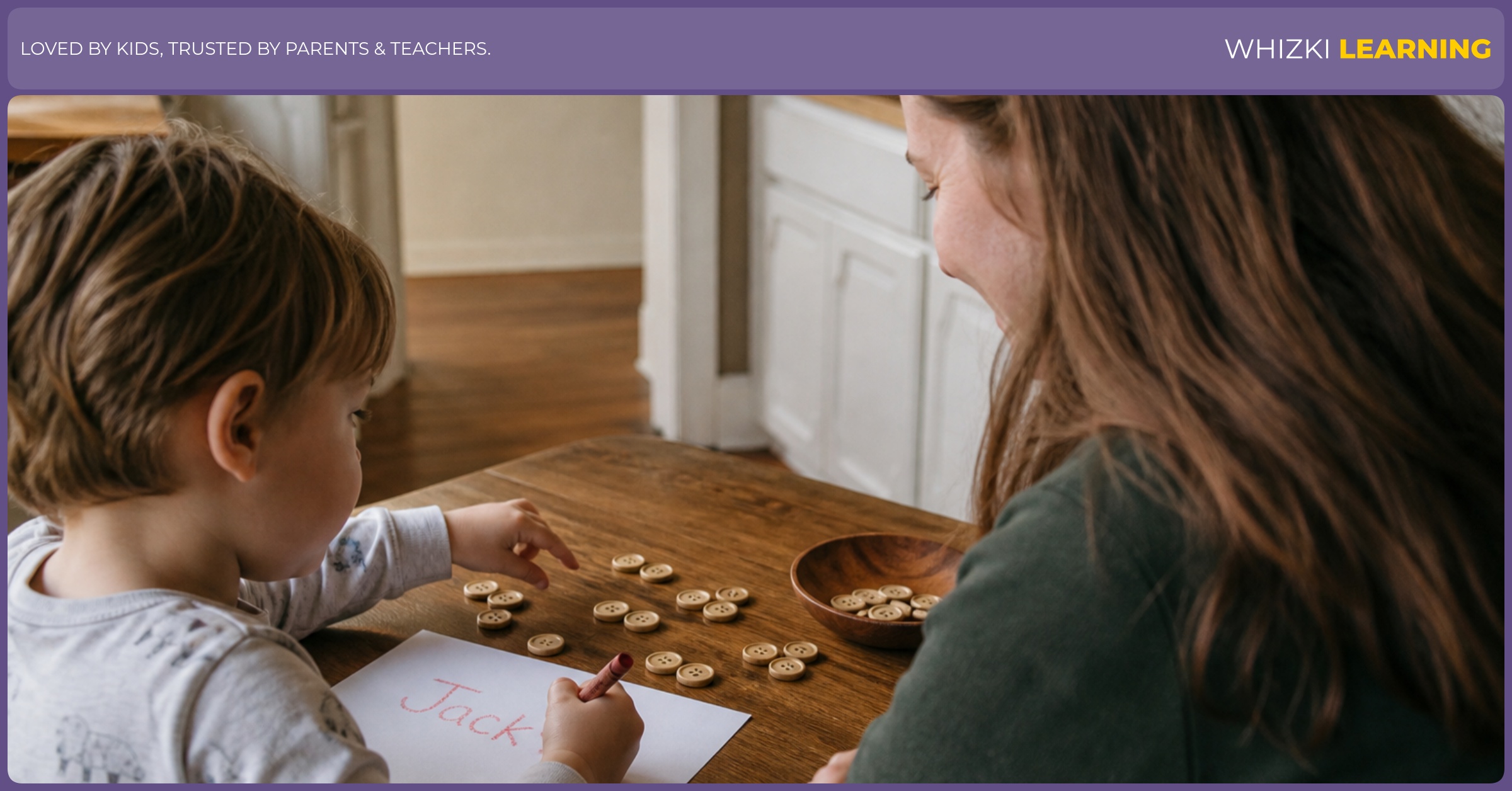 A parent sits beside a child at a kitchen table while the child counts small objects and writes a name with a crayon.