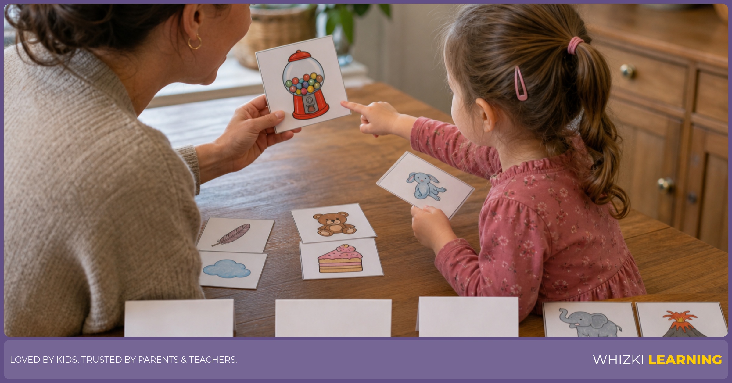 A parent and child at a kitchen table sorting T adjective cards into three piles with gentle focus