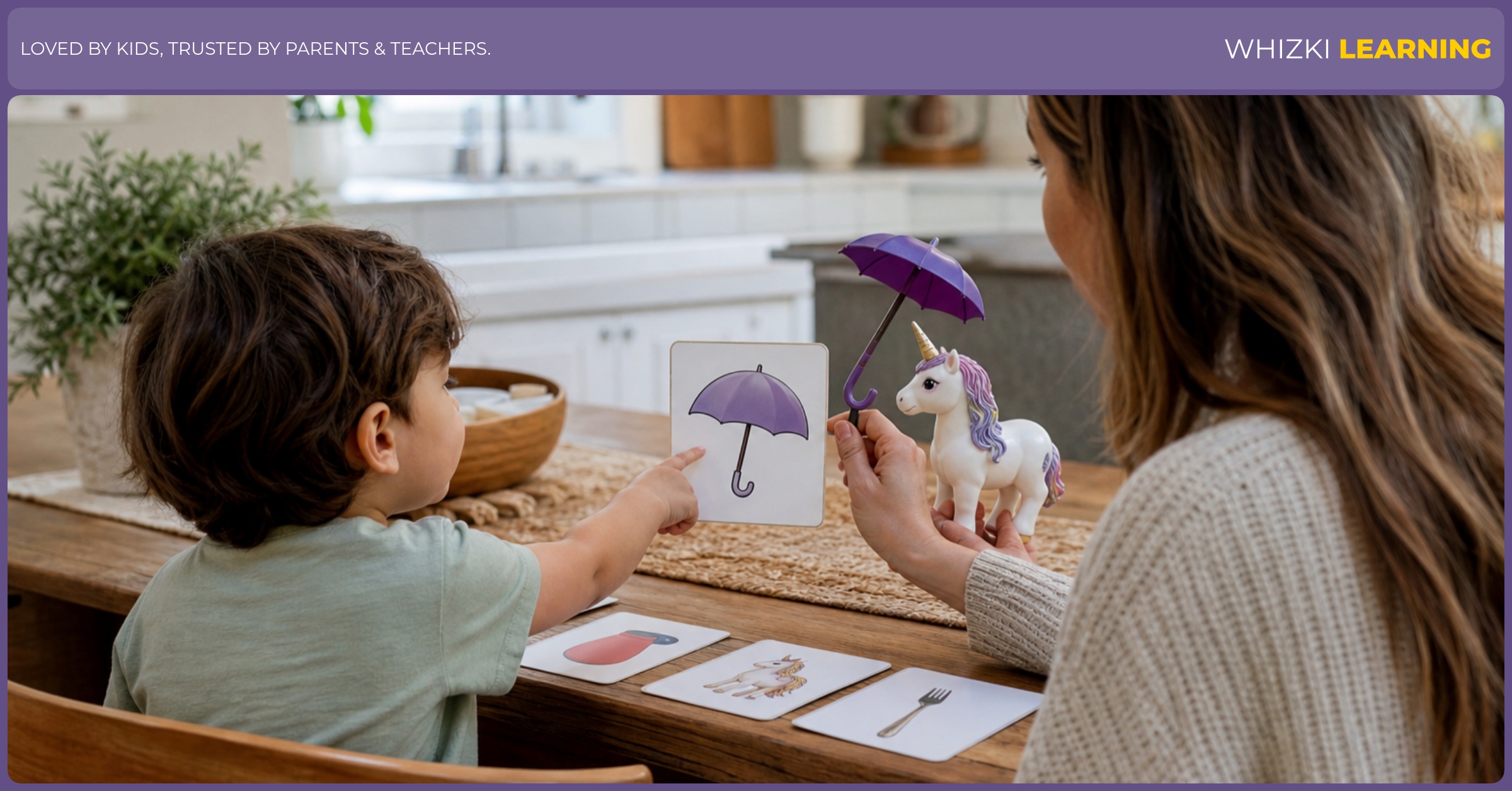Parent and child at a kitchen table pointing to U objects and practicing the word together