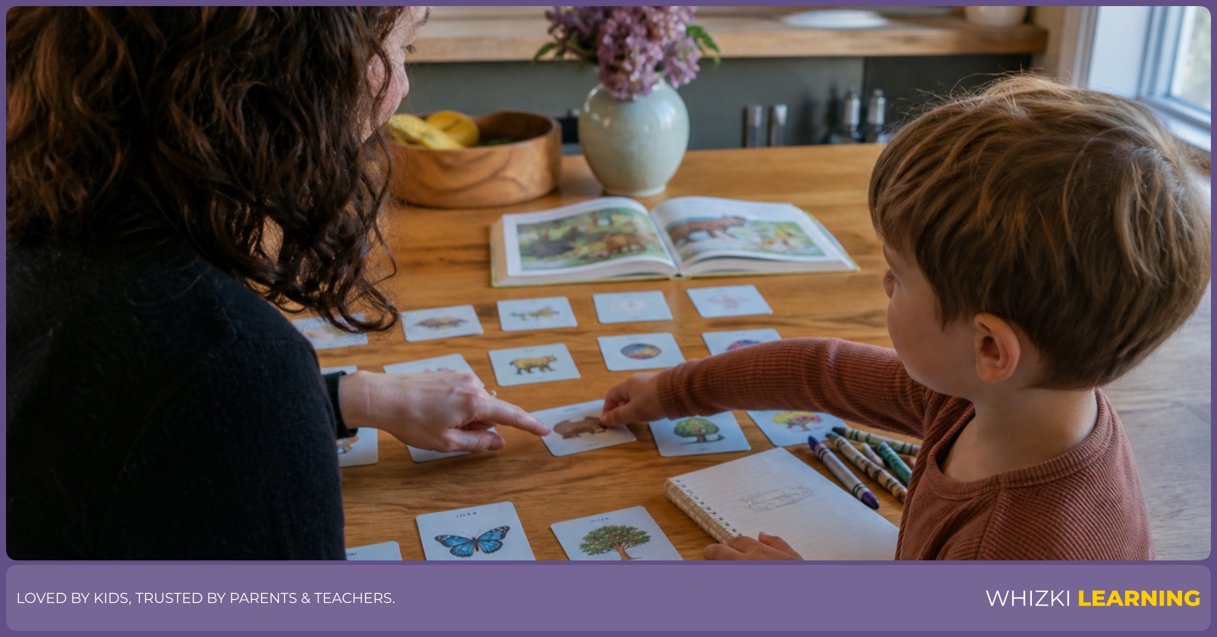 A parent and child arrange paper activity cards on a kitchen table for a calm weekly learning plan.