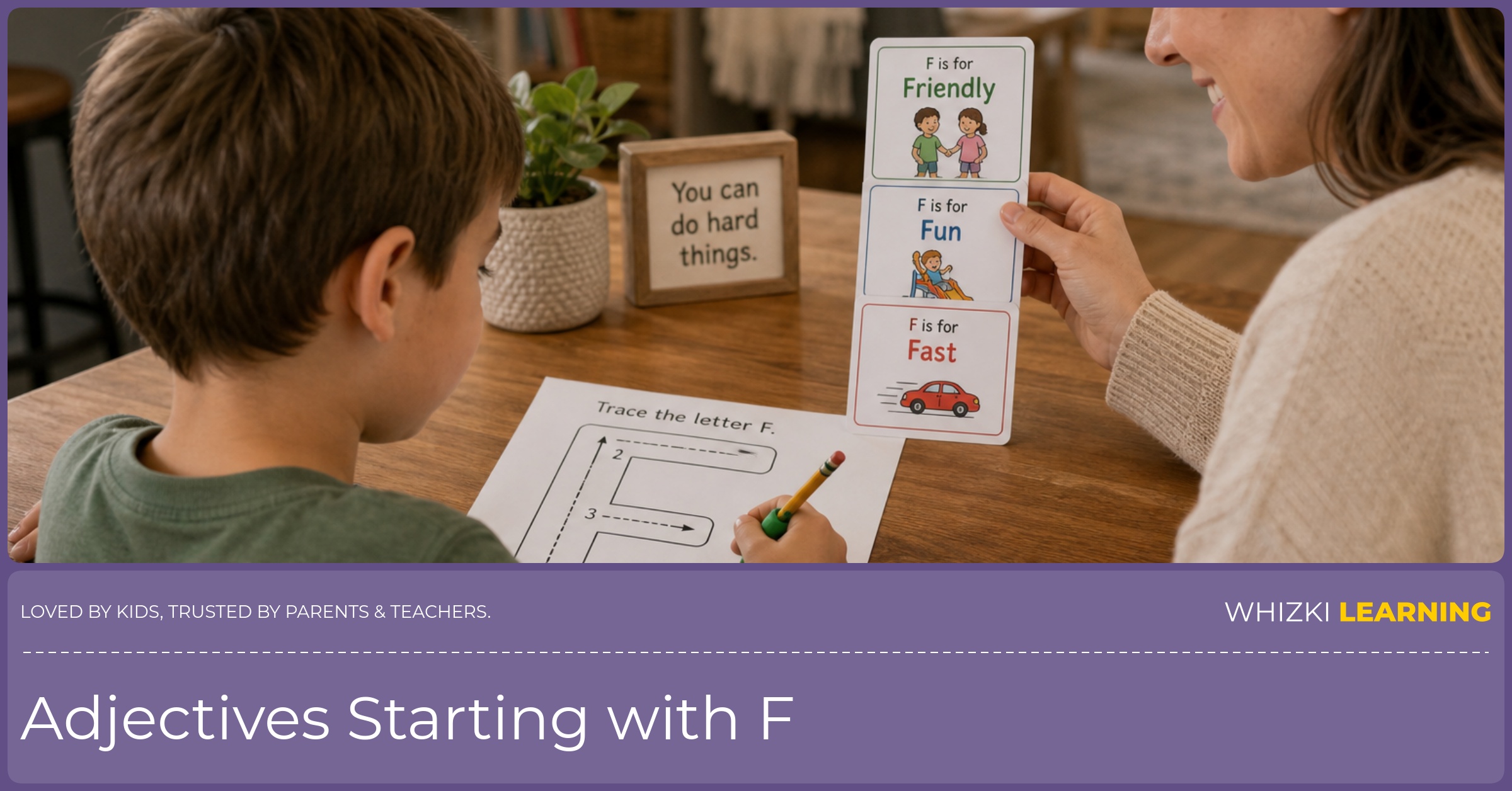 A parent helps a child trace and form the letter F while holding adjective cards, practicing calm focus in a home setting