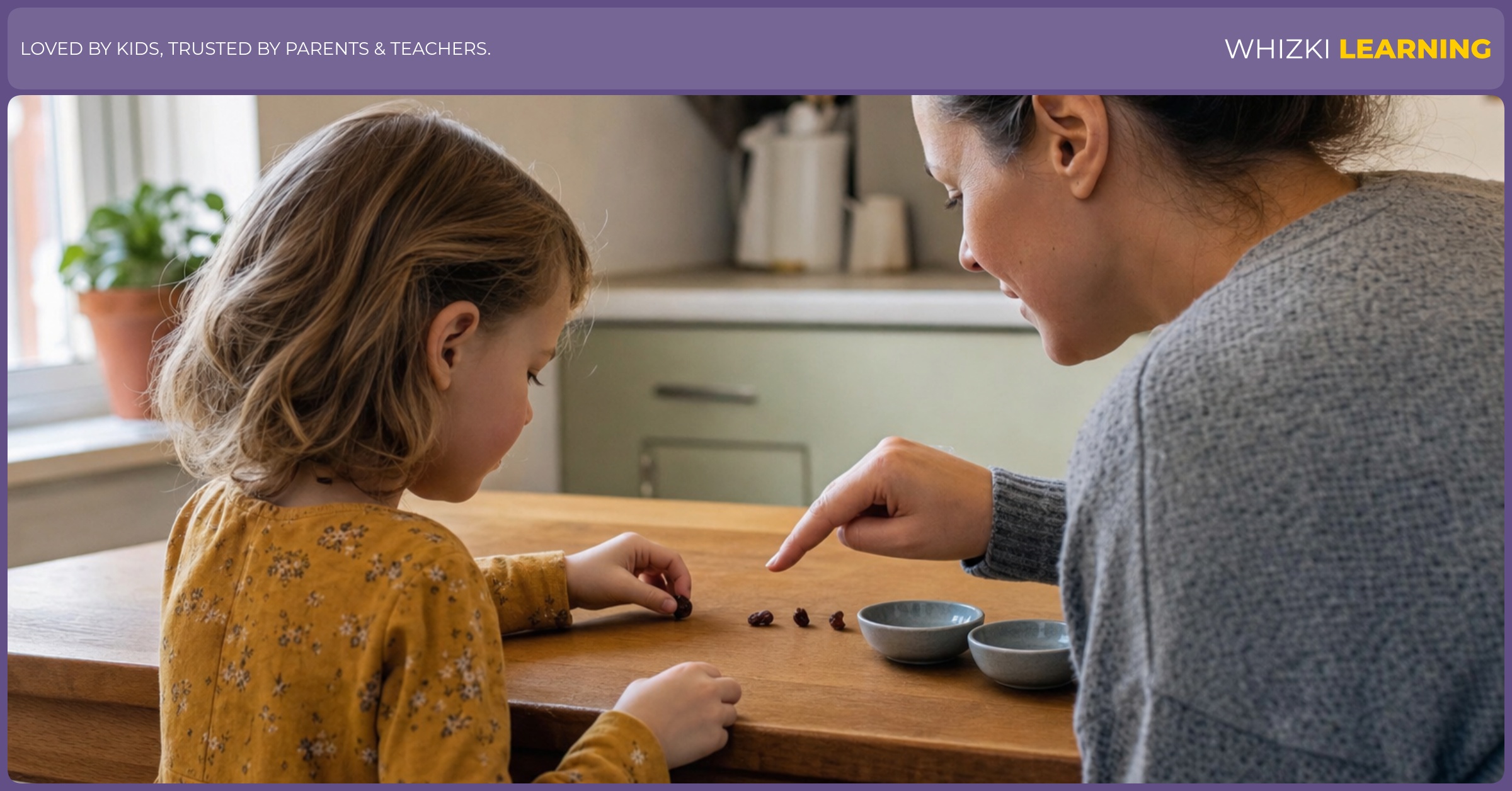 A parent helps a young child split four raisins into two small bowls at a kitchen table.