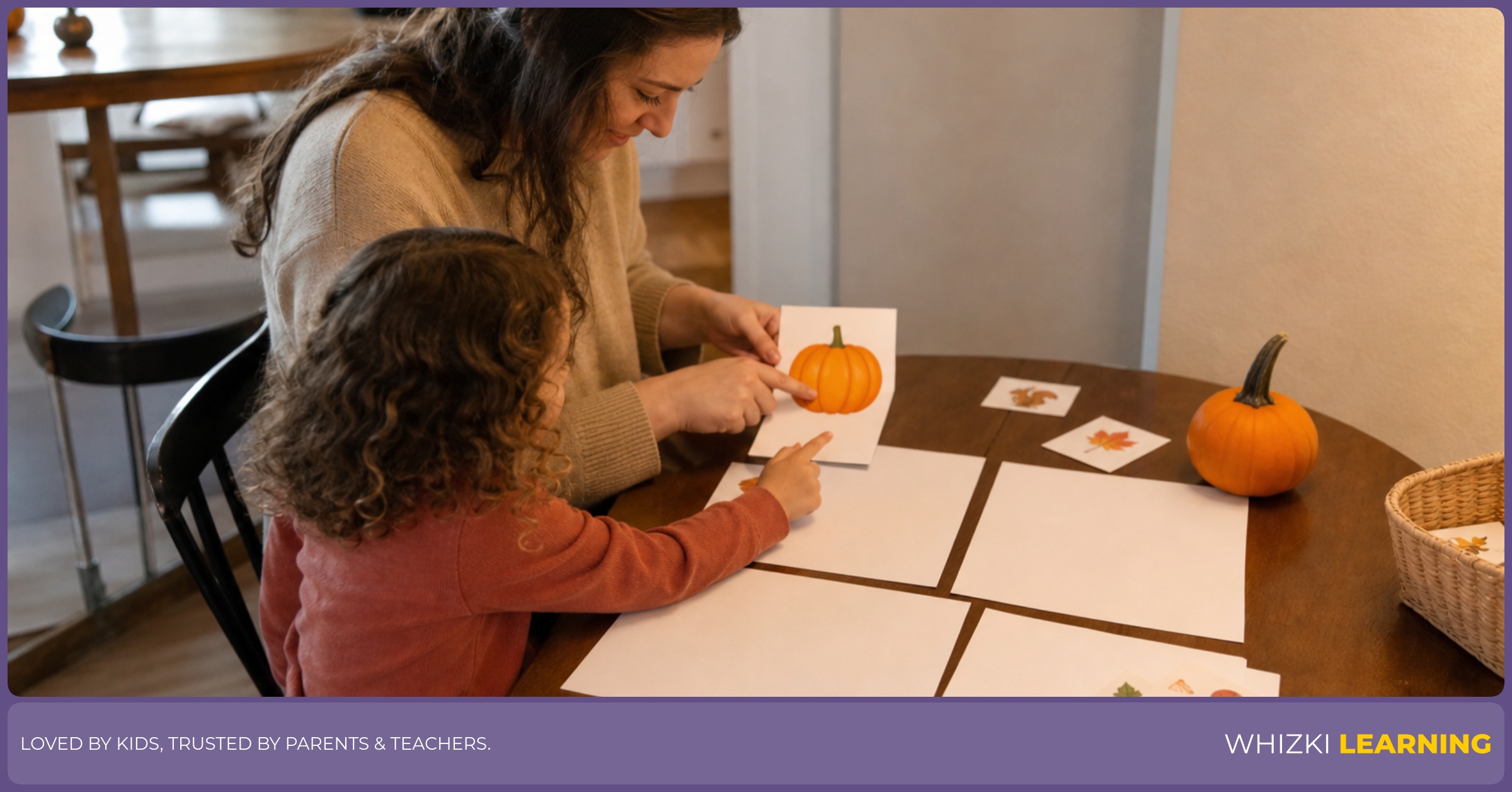 A parent and child plan a gentle October learning routine with crayons and paper at the kitchen table.