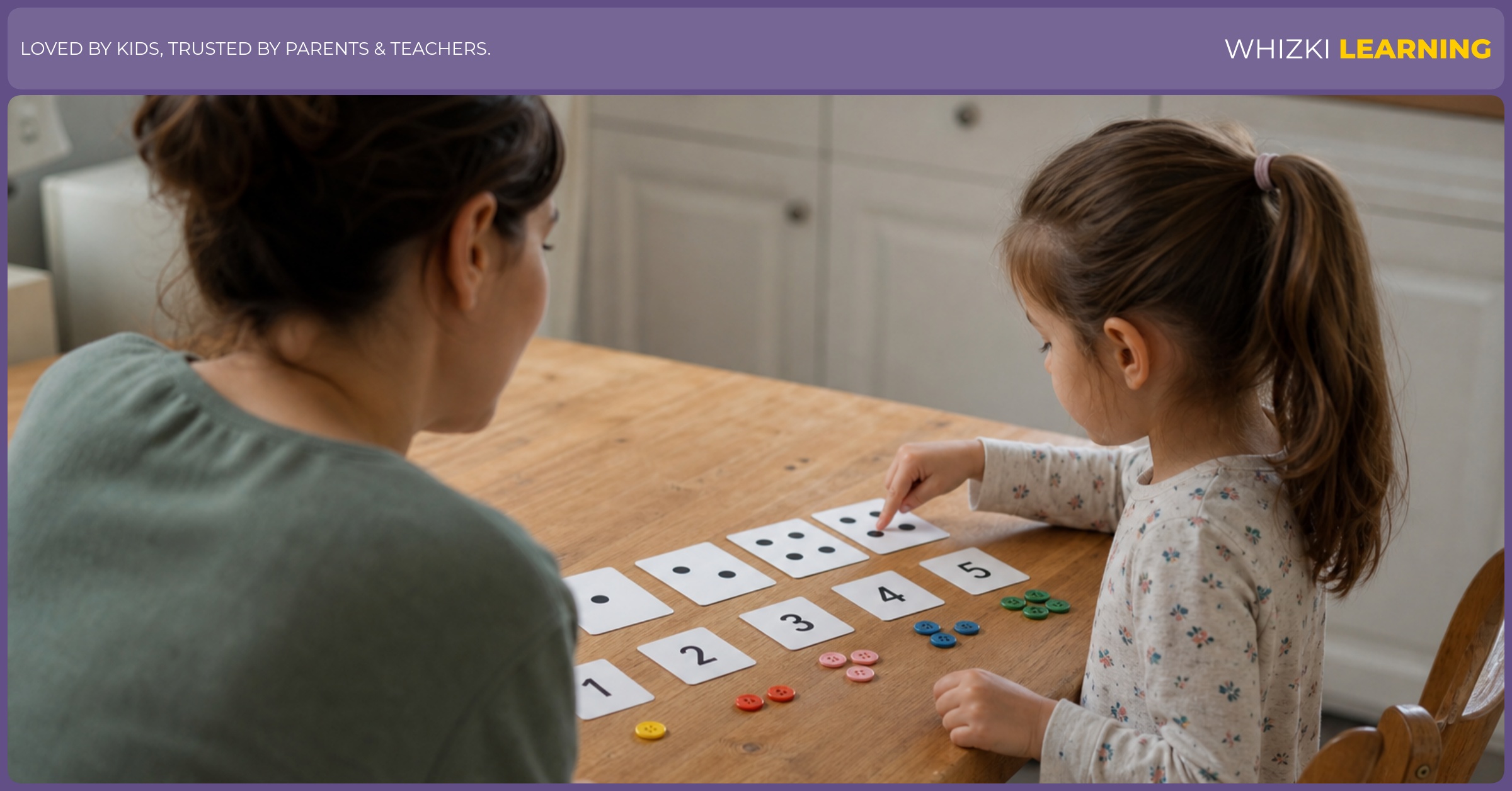 A parent and child sit at a kitchen table matching dot cards to numeral cards with small objects.