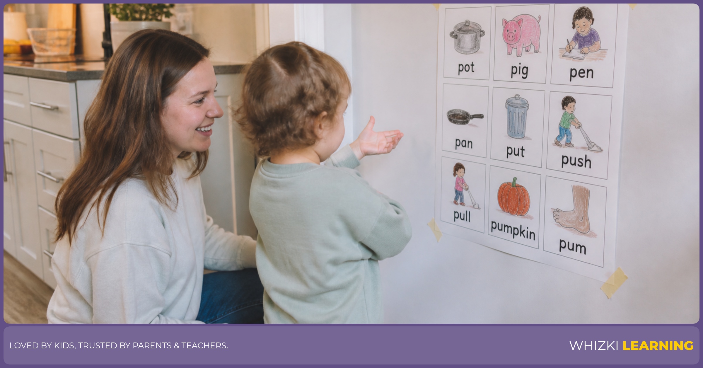 A parent and child act out P verbs beside a taped printable in a warm kitchen.