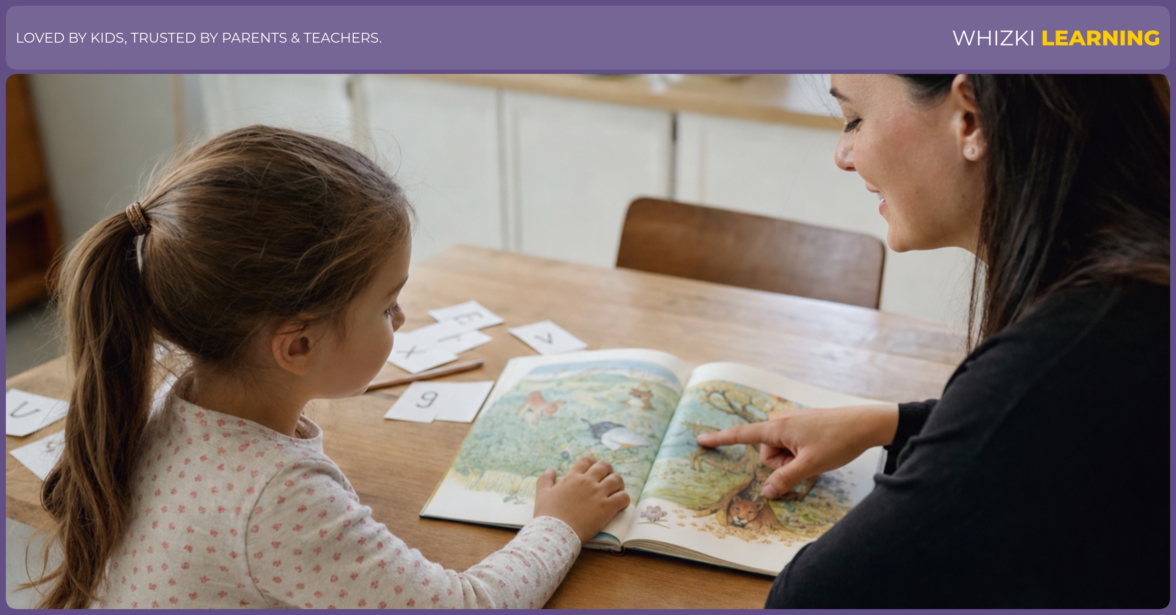 A parent and 5-year-old look at a picture book together while letter cards rest on the kitchen table.