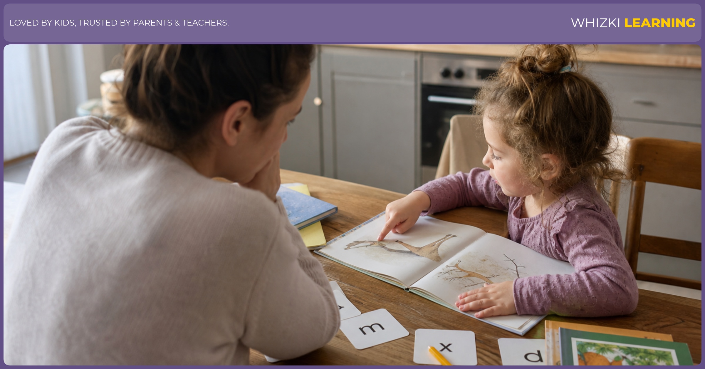 A parent and child sit at a kitchen table with a picture book and letter cards during calm reading practice.