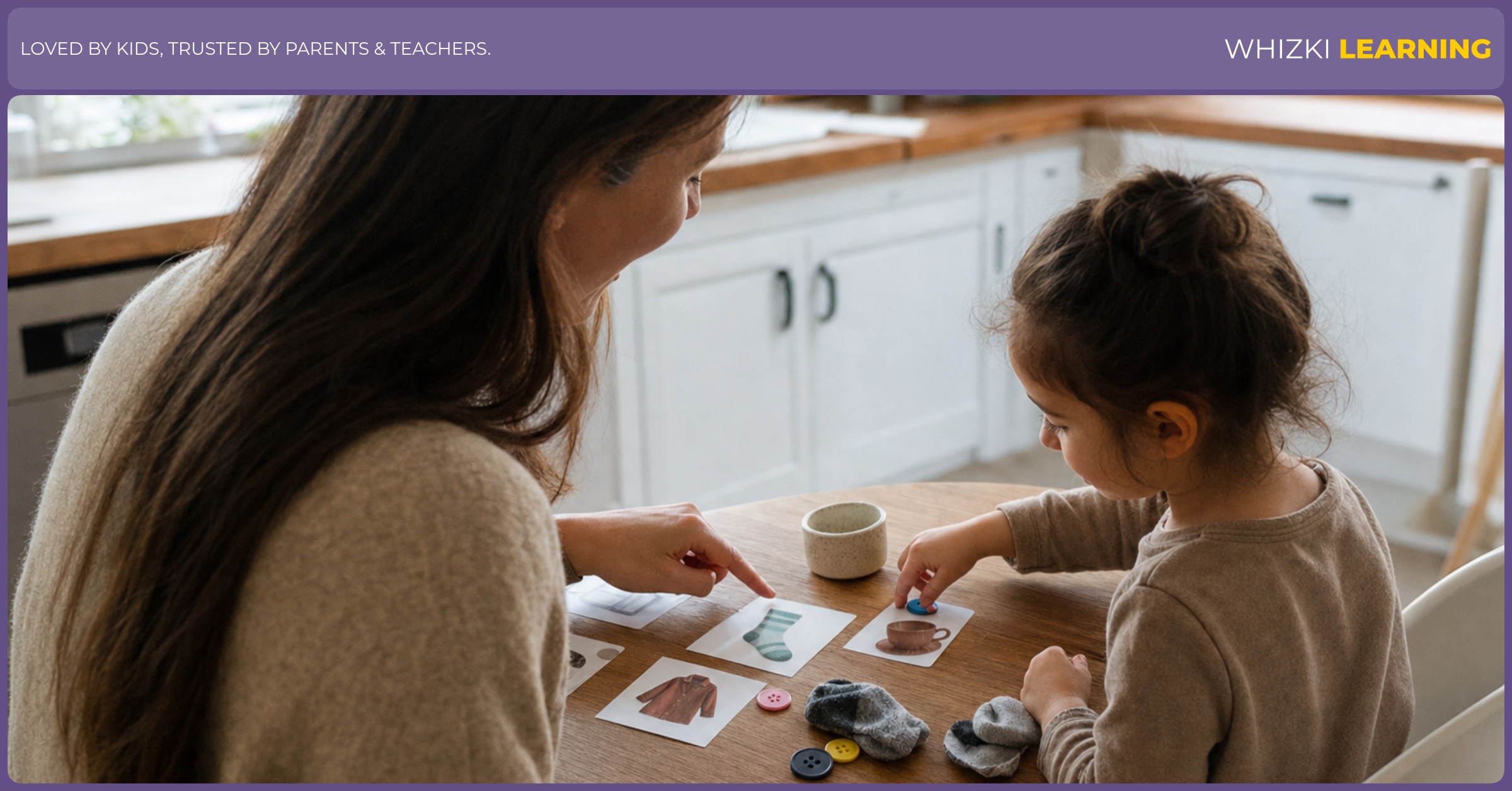 A parent and a 4-year-old sort picture cards and small household objects together at a kitchen table.