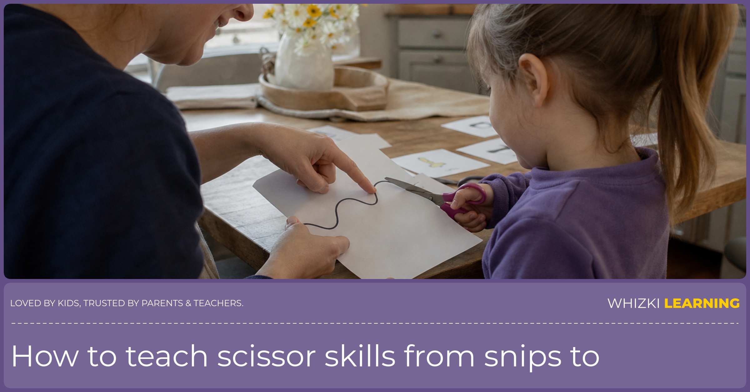 A caregiver guides a left-handed child using child-safe scissors to cut along a printed paper path.