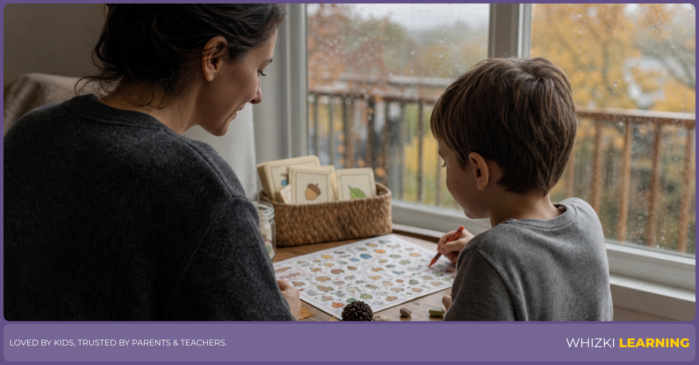 A caregiver and child use a rainy porch I-spy printable beside a window with crayons and small objects on the table.