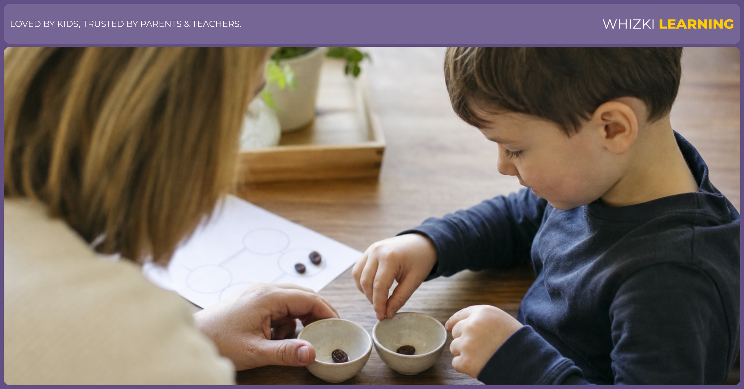 A parent and child sit at a kitchen table splitting two raisins into two small bowls.