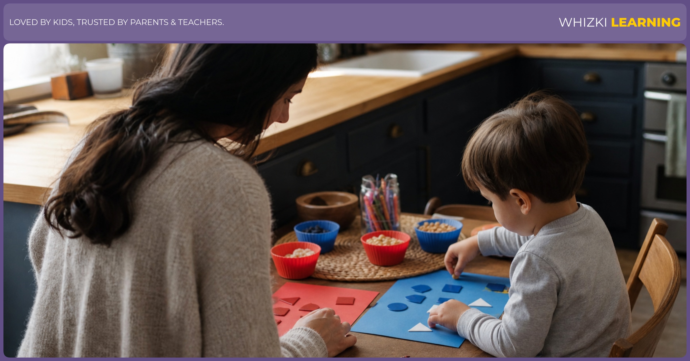 A caregiver and preschool child sort red and blue objects with paper shapes at a kitchen table.