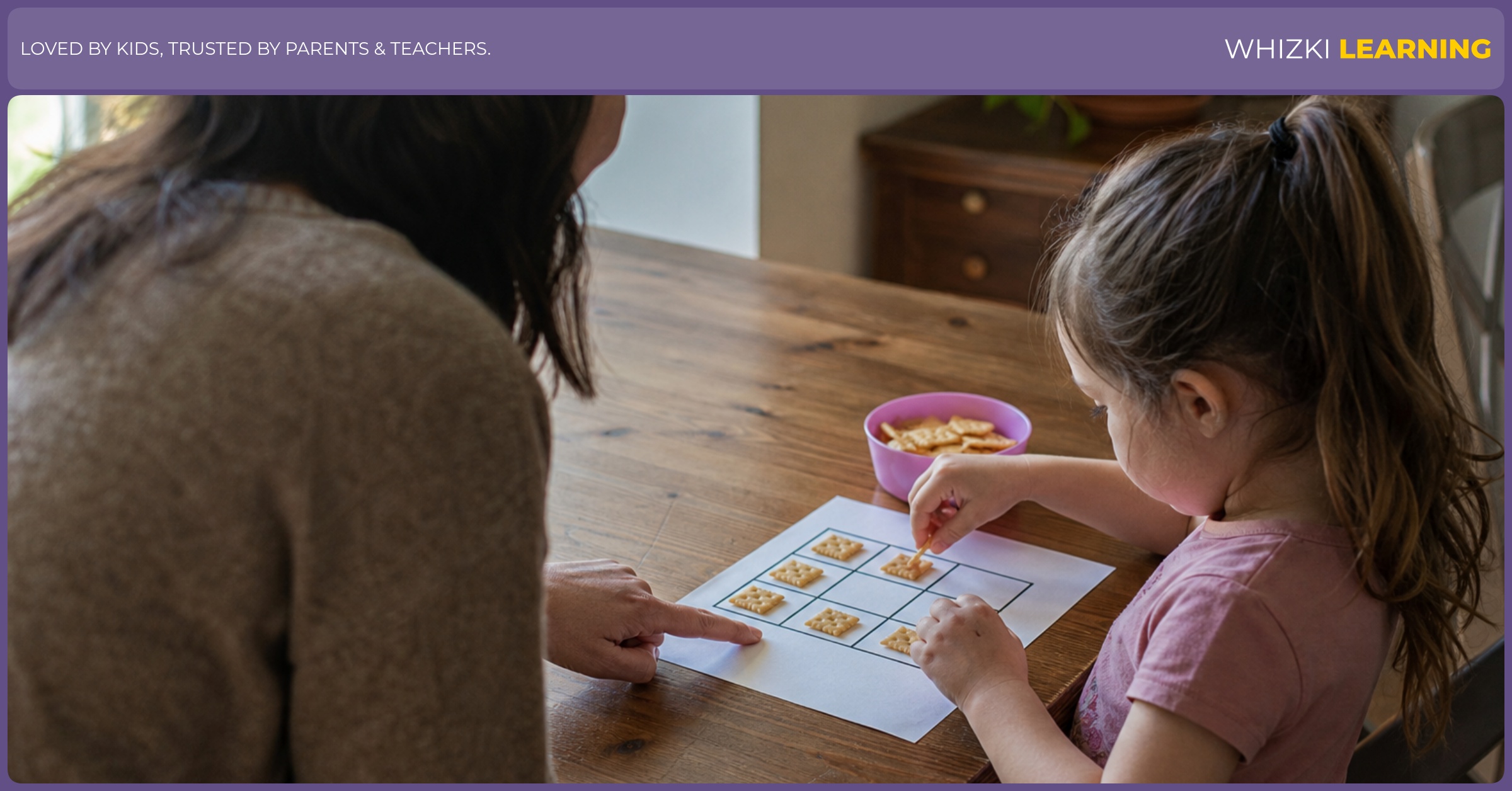 A caregiver and child place small snacks on a paper ten frame during a calm kitchen table math routine.