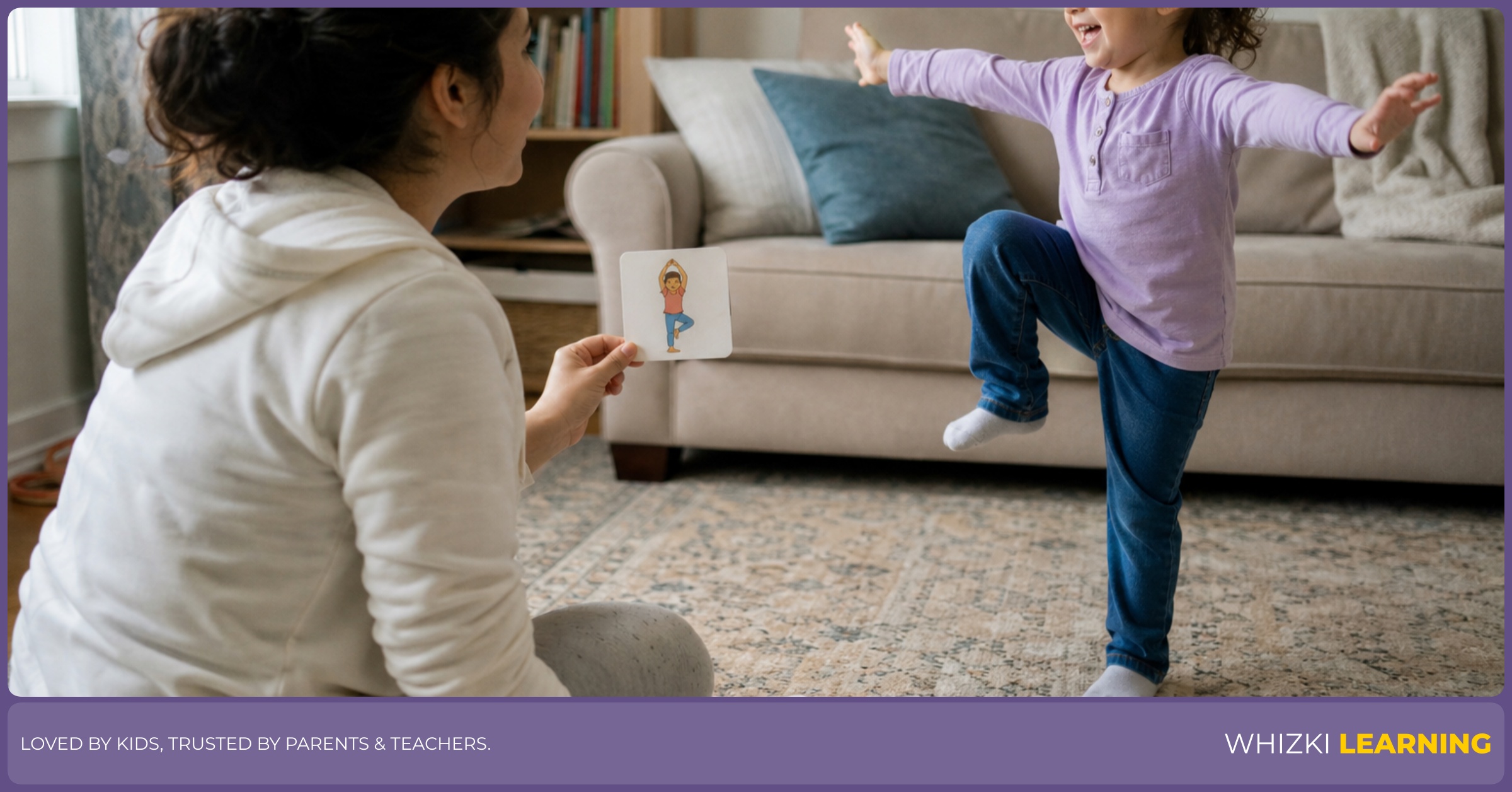 A parent watches a young child act out D verb cards on a living room rug.