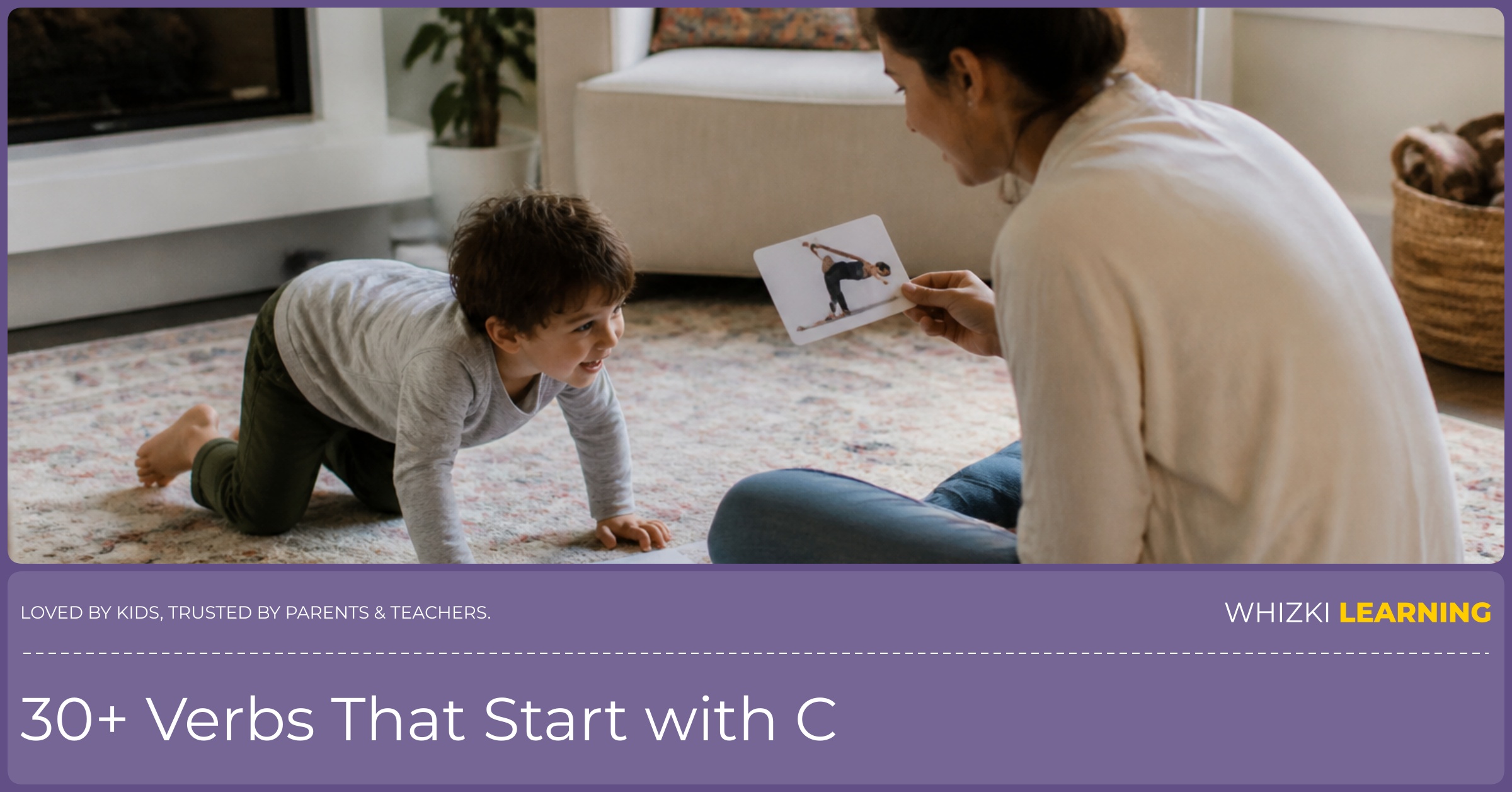 A parent and child act out C verb cards on a living-room rug with paper cards nearby.