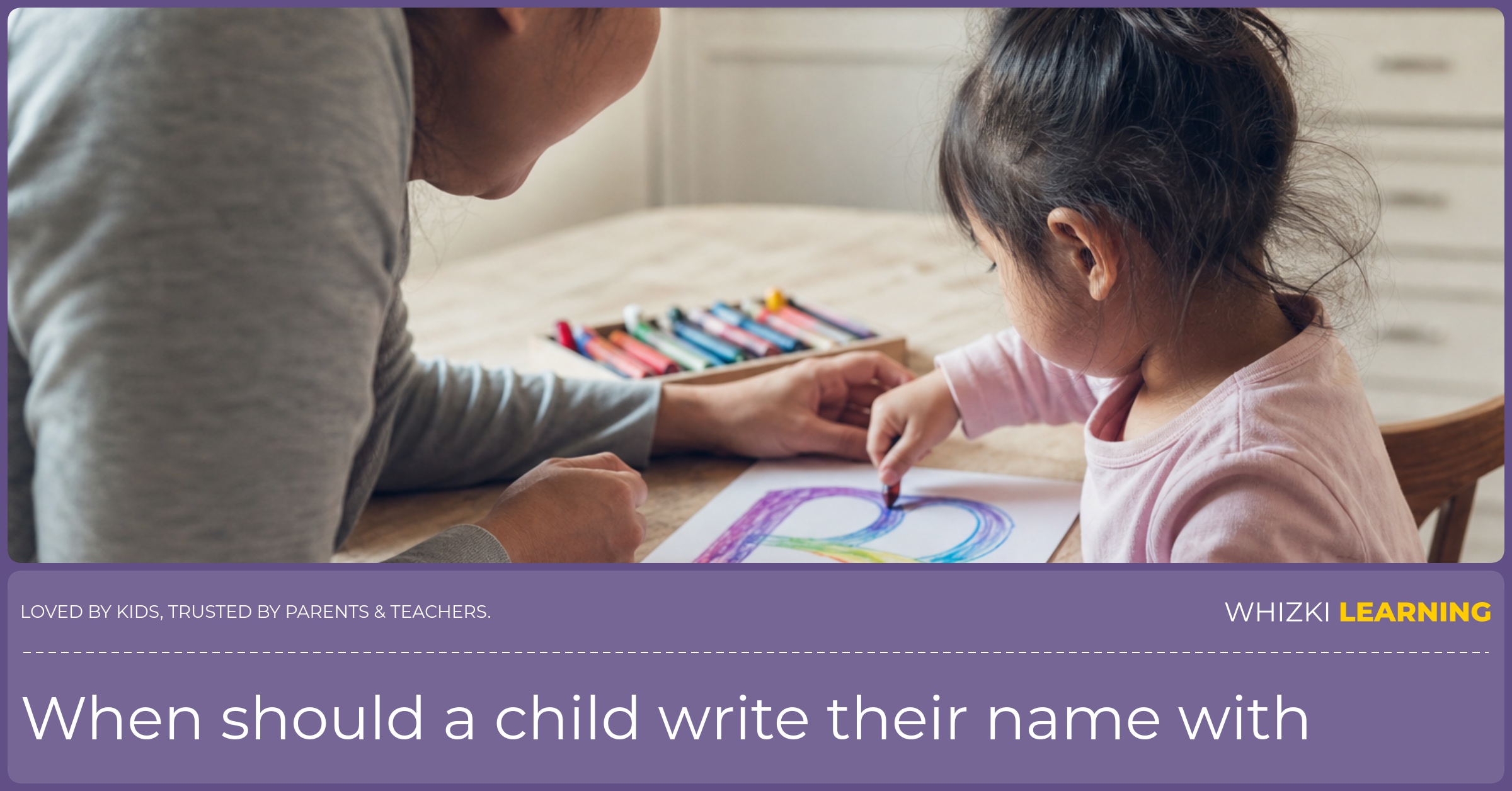 A caregiver sits beside a child making a large rainbow first letter with crayons at the kitchen table.