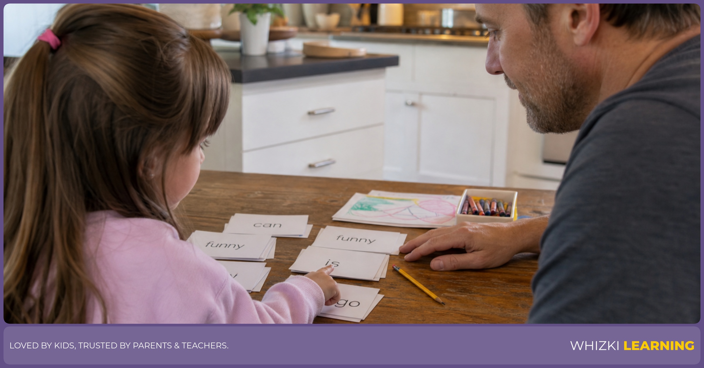 A parent sits beside a preschool child and practices paper sight-word cards at a kitchen table.