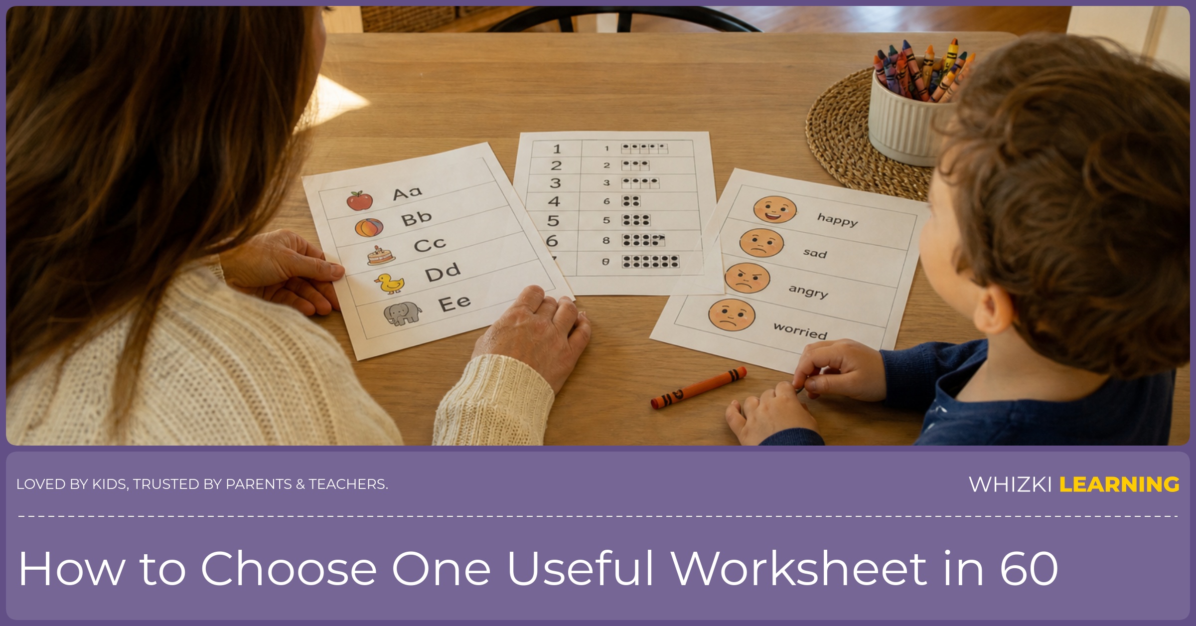 A parent and young child sit at a kitchen table choosing one worksheet from three paper pages.