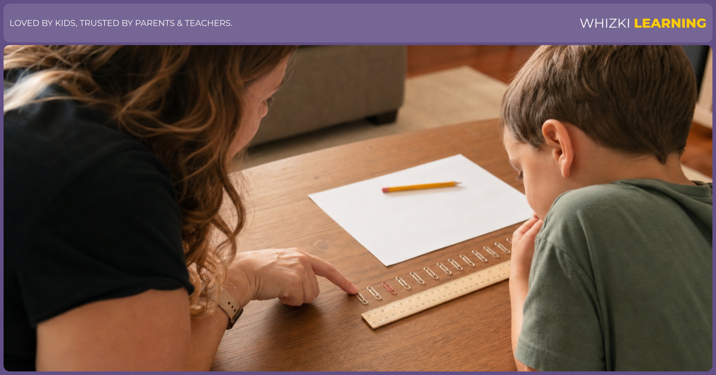 A child compares a row of paper clips with a ruler while an adult points to the shared start point.